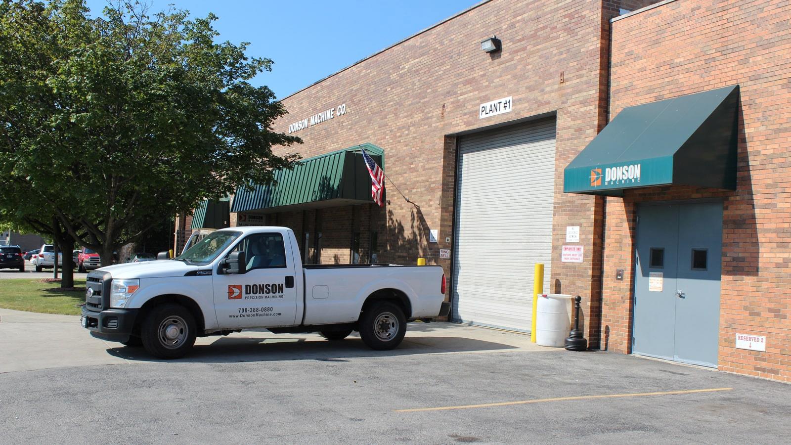 White van in front of warehouse at Chicago company Donson Machine